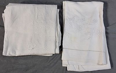 Pair of Vintage Embroidered Linen Tablecloths. There is a hand embroidered tablecloth that is 