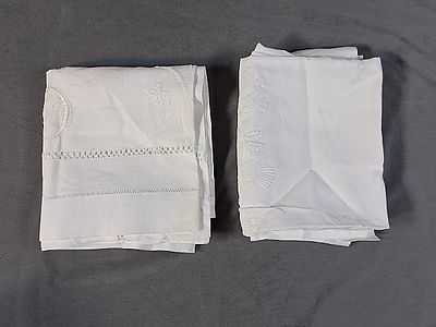 Pair of Hemstitched Vintage Linen Tablecloths. There is a vintage white linen tablecloth that 