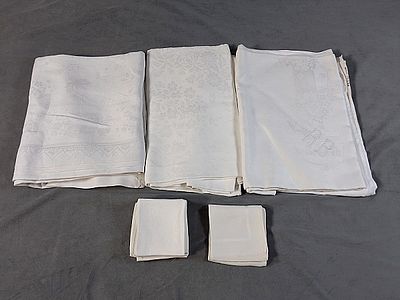 3 Vintage Linen Damask Tablecloths and Group of Napkins. Included are 3 vintage linen damask 