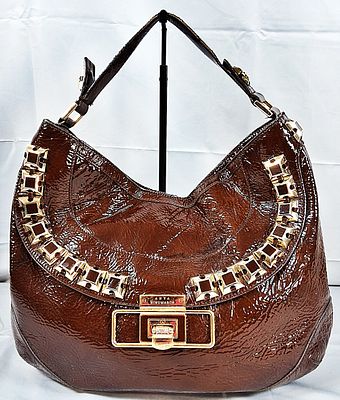 Anya Hindmarch Hobo Bag. This Anya Hindmarch hobo is decorated with gold tone hardware to make 
