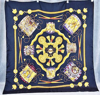 Hermes Les Tambours Silk Scarf. This scarf's design was created by Joachim Metz in 1989 and it 