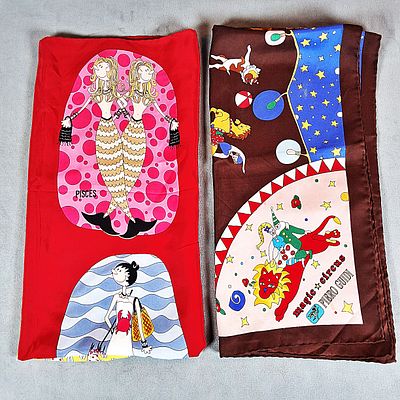Moschino and Piero Guidi Scarves. There is a Moschino silk scarf and a Piero Guidi silk scarf 