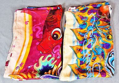 2 Ed Hardy Shawl Scarves. The two chiffon scarves are designed by Christian Audigier. There is 