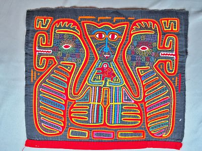 Guna Mola Panel with Cat Figure Holding Bird between Twin Serpentine Creatures. Panama (Guna 