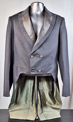 Antique 1900 Men's Black Tailcoat. Antique black tailcoat that is made from wool. There are four 