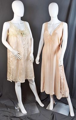 2 Vintage Pink Silk Slips. There are 2 vintage pink silk slips with lace applique along the bust 