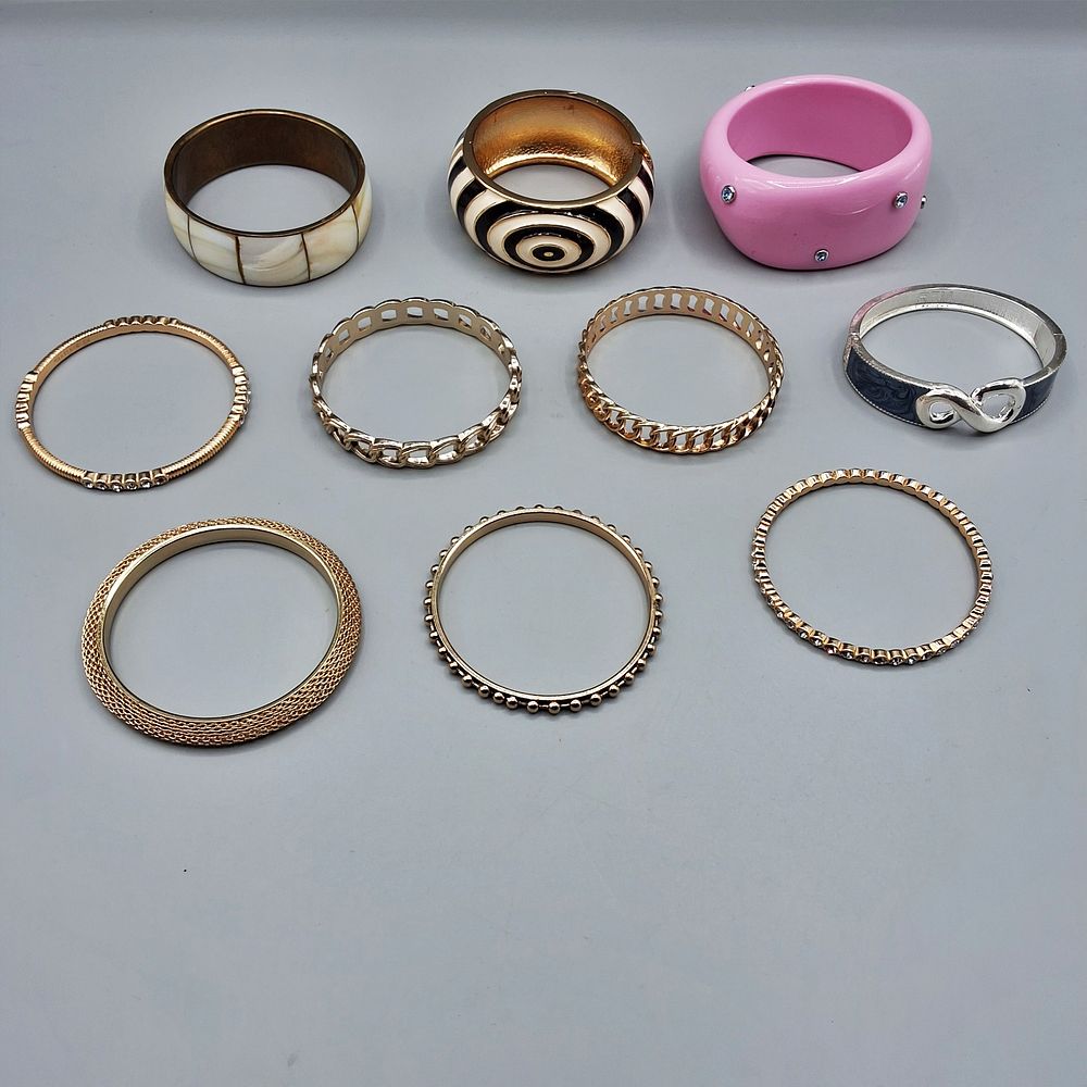 Lot 167: 11 Gold Tone and Bangle Bracelets