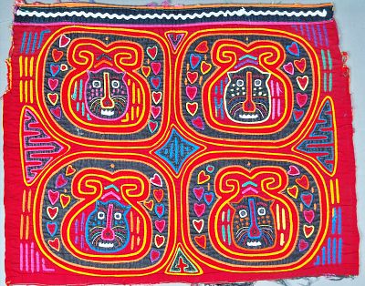 Guna Mola Panel Four Jaguar Spirit Masks. Panama (Guna Yala), circa 1970s14 &times; 18 inches Striking 