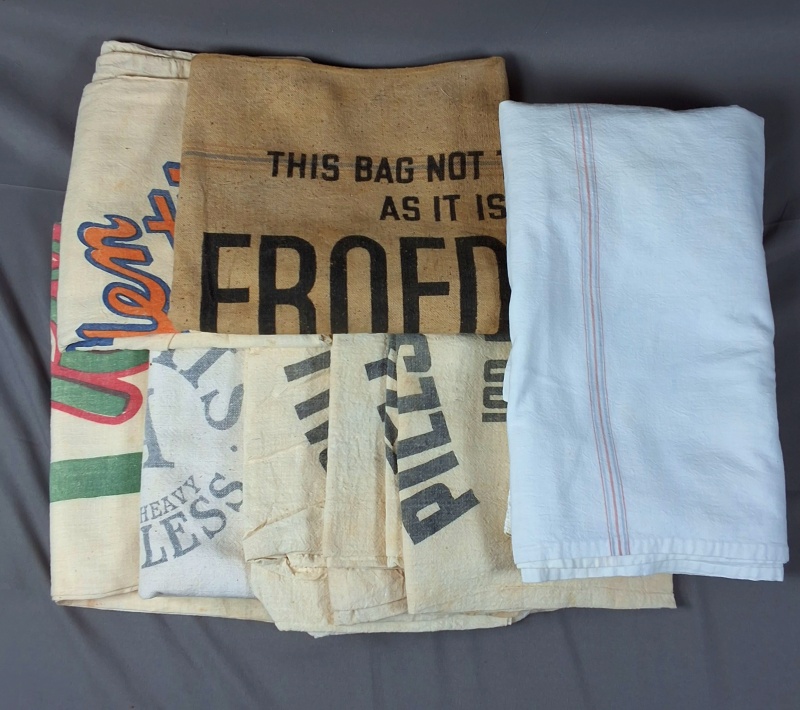 Group of 7 Complete Vintage Advertising Feedsacks & Tablecloth