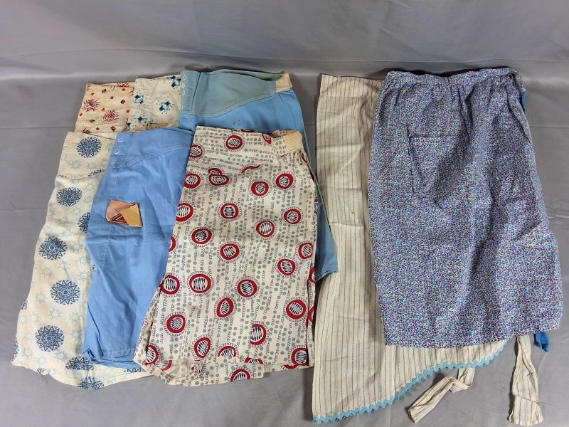 Lot 16: 6 Shorts and 2 Aprons