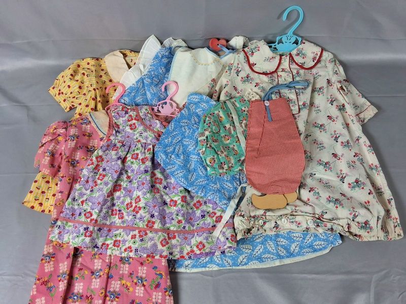 Lot 12: 9 Conversational Print Children's Dresses and Bonnets