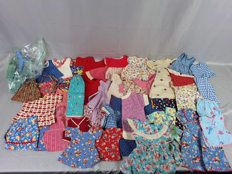 Lot 25: Group of 38 Doll Clothing with Hangers