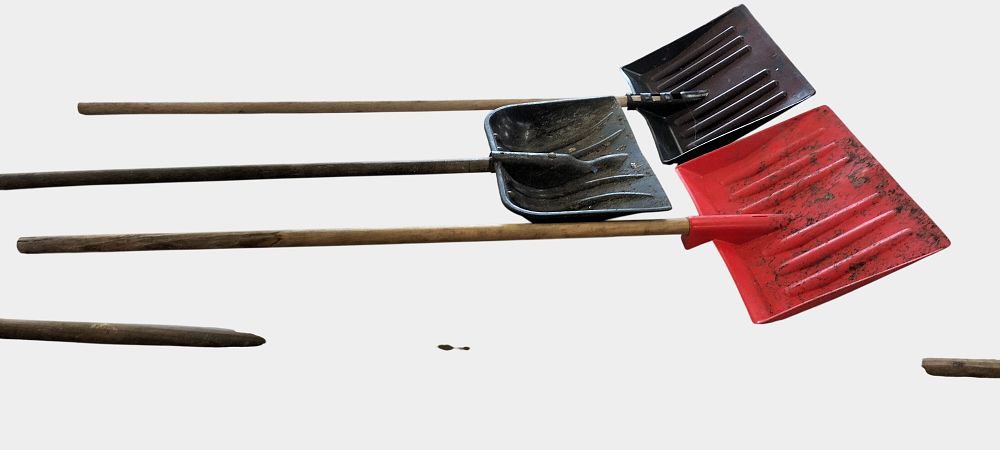 Lot 425: Four long-handled tools, including three snow shovels and spare handle