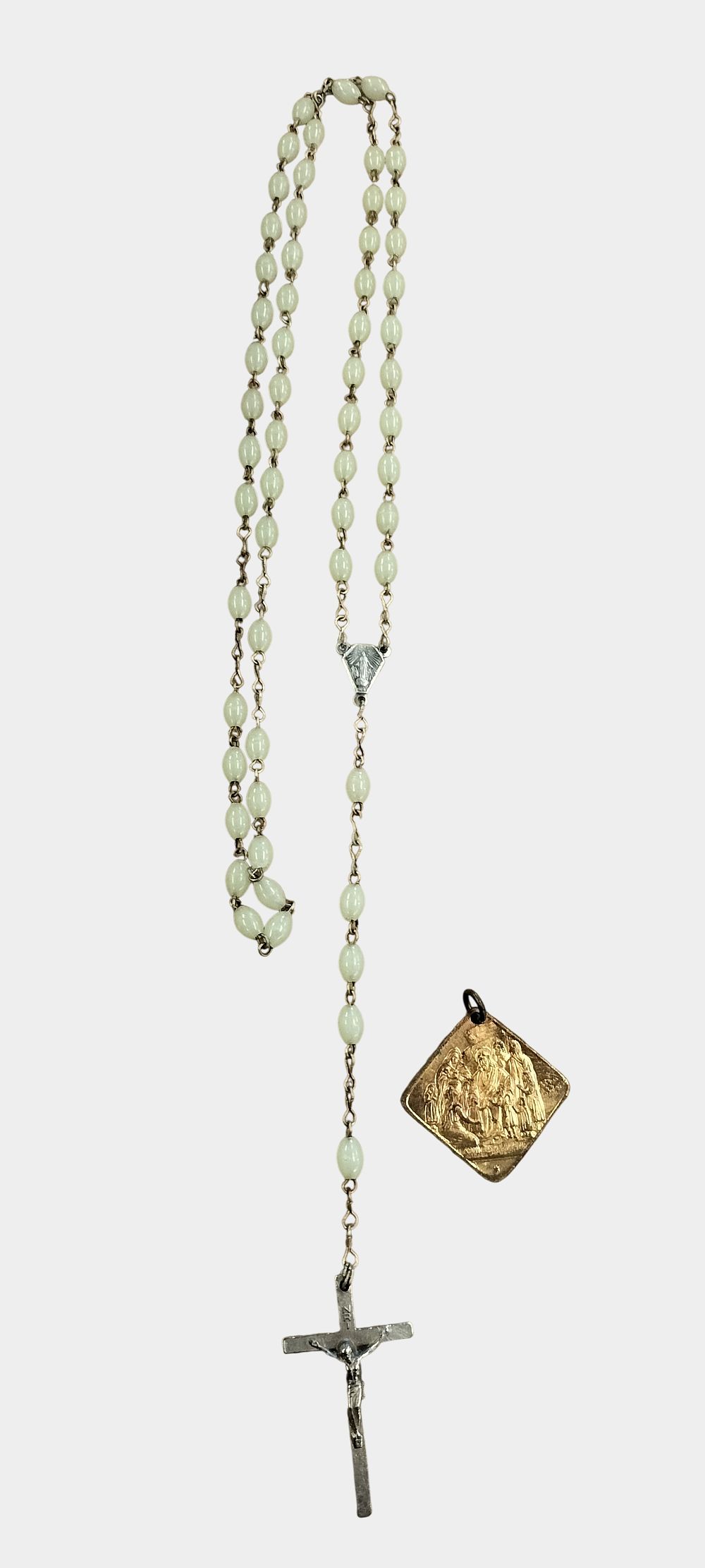 Lot 464: Two religious items comprising a luminous five-decade rosary and an English gilt metal devotional pendant