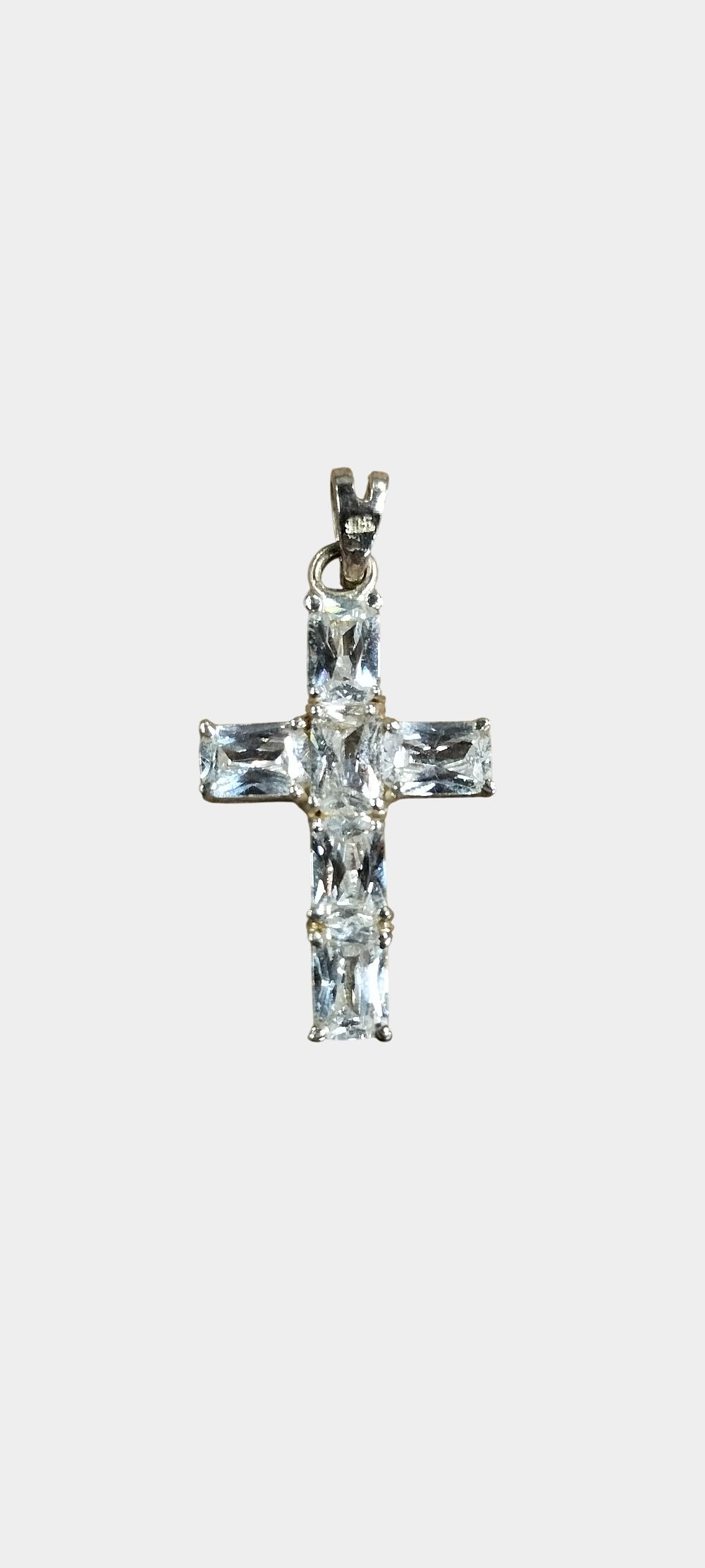 Lot 466: A Sterling Silver and Rectangular-Cut Clear Stone Cross Pendant