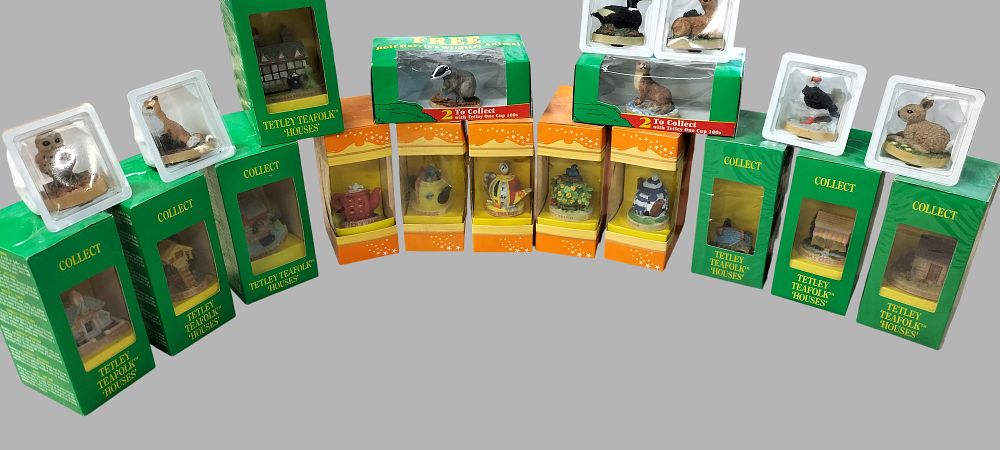 Lot 368: A Collection of Twenty Tetley Teafolk Houses, Teapots, and Rolf Harris Wildlife Animal Figurines
