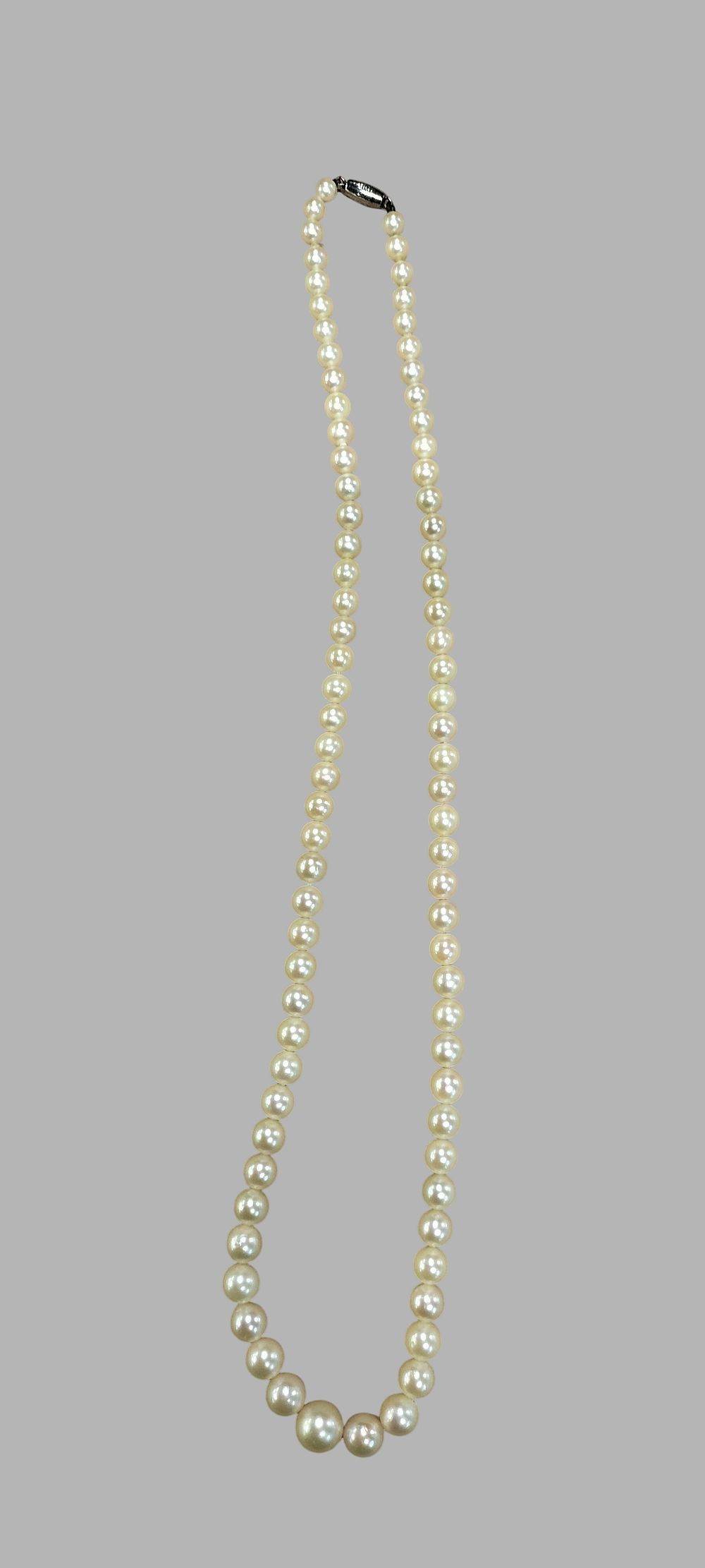 Lot 380: A  Single Strand Graduating Natural Pearl Necklace with 9ct White Gold Clasp