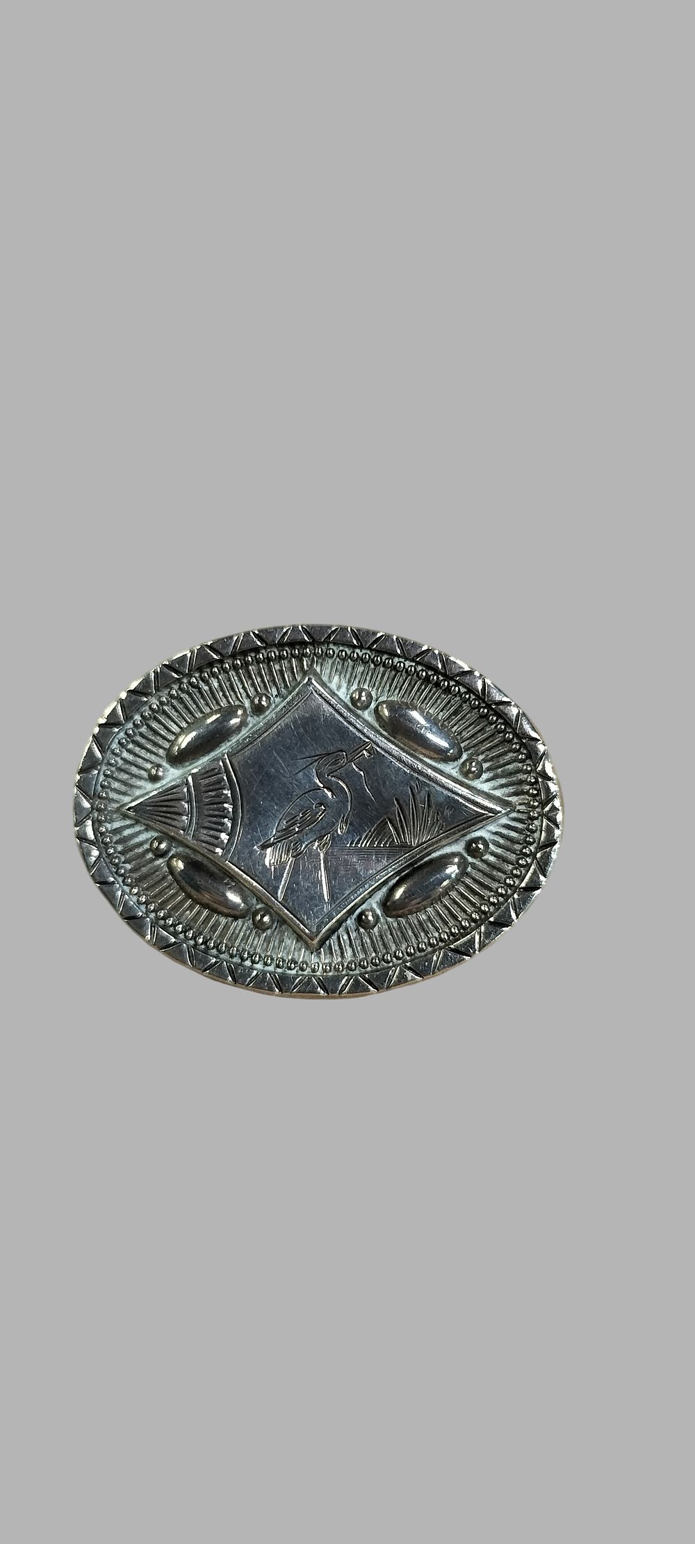 Lot 389: A Vintage Standard Silver Oval Picture Brooch with Engraved Heron Motif