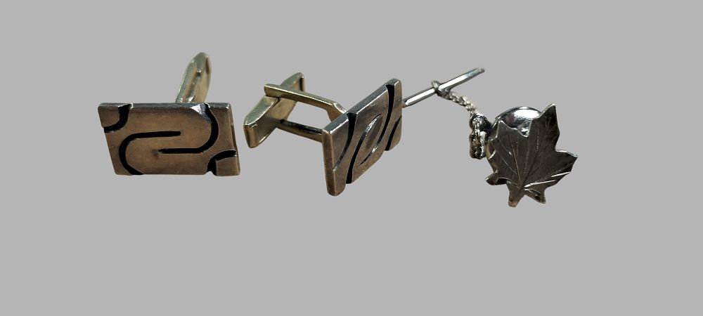 Lot 390: A Trio of Sterling Silver Men's Jewellery comprising Taxco Modernist Cufflinks and a Smibo Maple Leaf Tie Tac