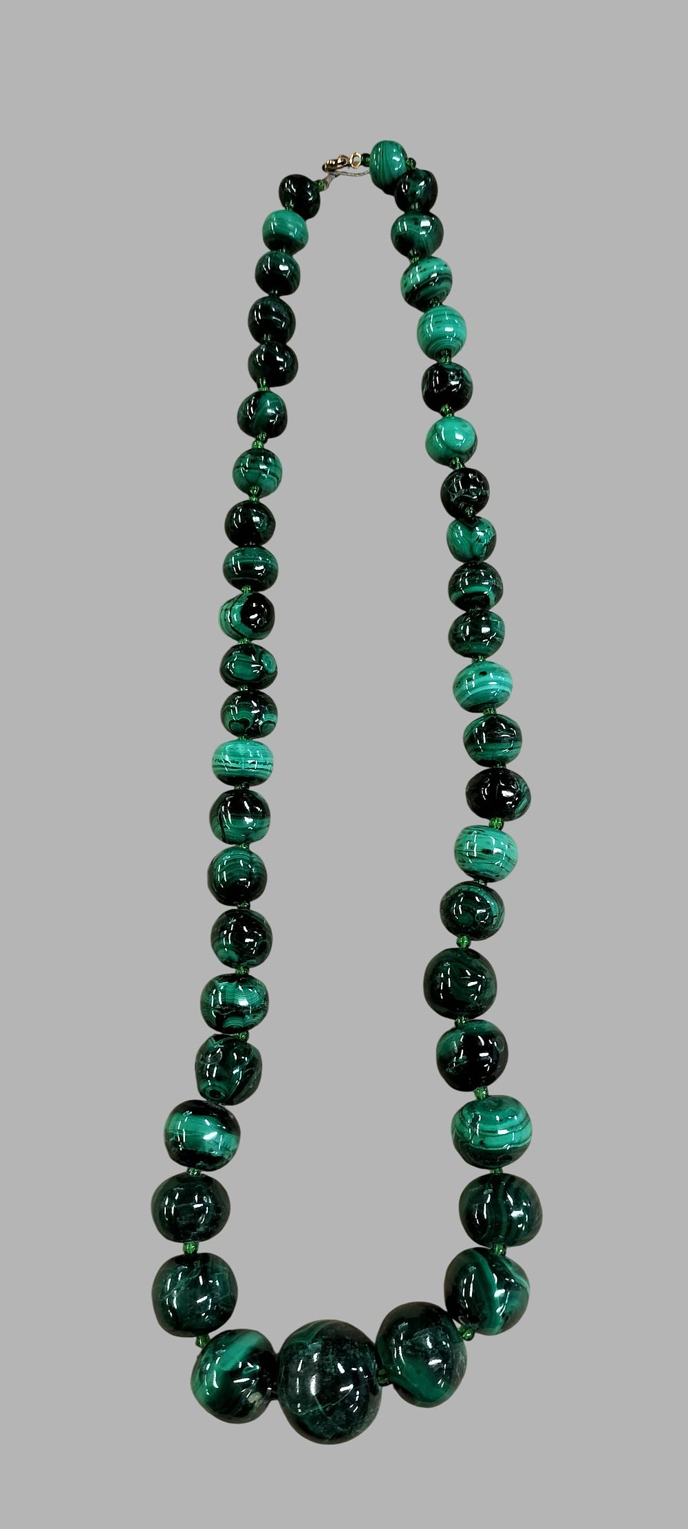 Lot 403: A Graduated Malachite Bead Necklace
