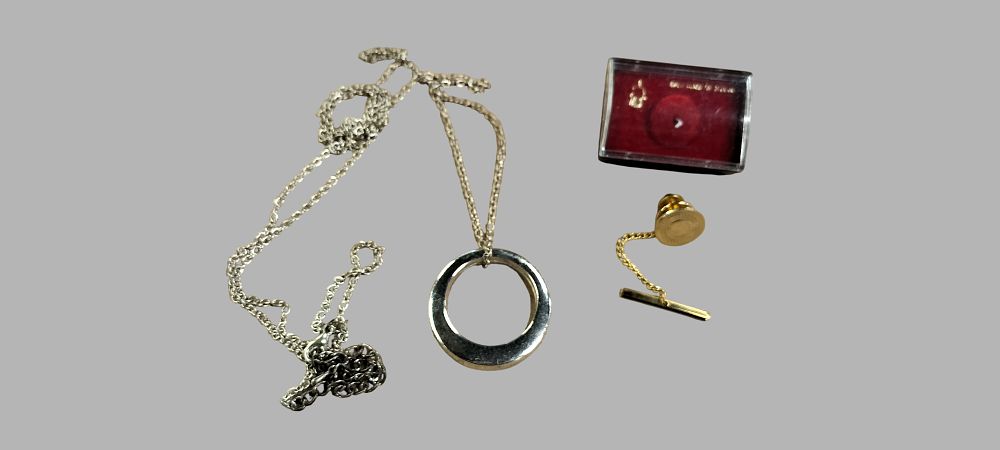 Lot 404: A Two Jewellery and Accessories Including a Gold  tone Tie pin Charm
