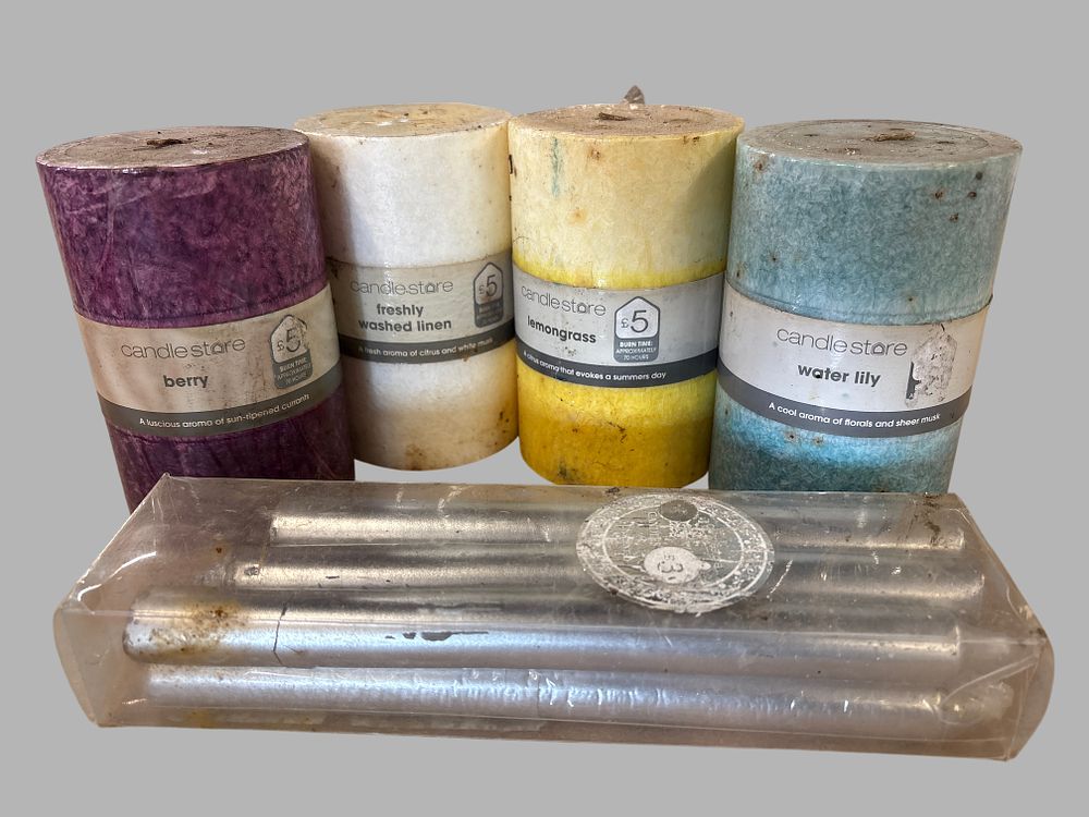 Lot 426: A Collection of Candlestore Scented Pillar and Silver Metallic Taper Candles