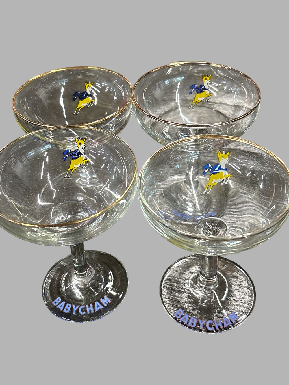 Lot 428: A Set of Four Vintage Babycham Champagne Coupe Glasses