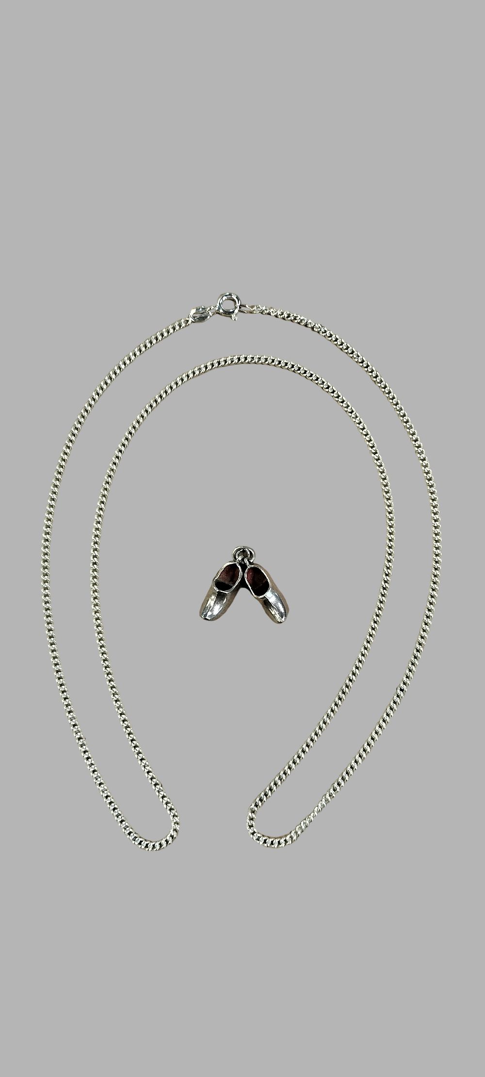 Lot 441: A Silver Curb Link Necklace with Dutch Silver Clog Pendant