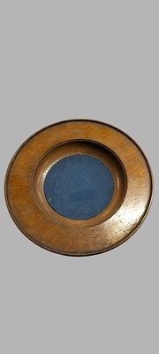 A Liberty and Co Arts and Crafts English Oak and Pewter Bottle Coaster
