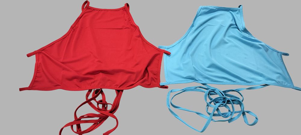 Lot 217: A Pair of Contemporary Halter-Neck Wrap-Tie Tops in Red and Light Blue