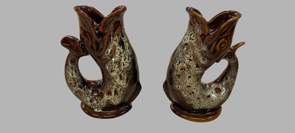 Lot 218: A Pair of Foster's Studio Pottery Cornwall Honeycomb Glaze Fish Vases