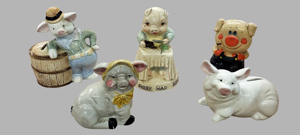 Lot 219: A Collection of Five Pig Still Banks