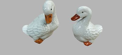 A Pair of White Glazed Ceramic Duck Figurines