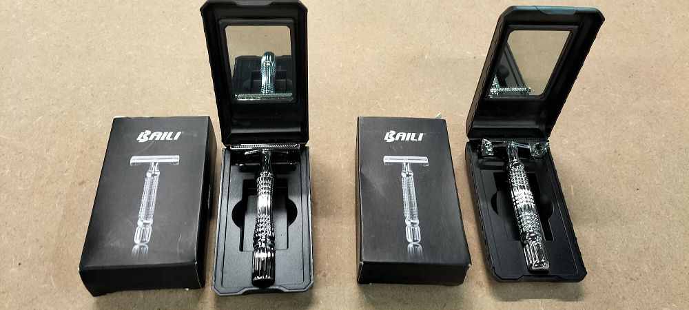 Lot 253: A Pair of BAILI BD179C Butterfly Double Edge Safety Razors with Travel Cases
