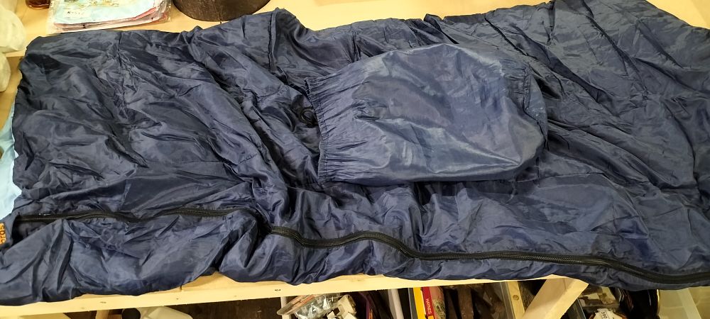 Lot 300: A Halfords Navy Blue Synthetic Adult Sleeping Bag and Stuff Sack