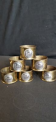 A Set of Six Vintage Brass and Silver Toned Souvenir Napkin Rings Depicting Cologne Cathedral