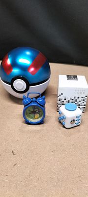 A Collection of Modern Toys and Novelties including a Pok&eacute;mon Great Ball and iLloom Balloons