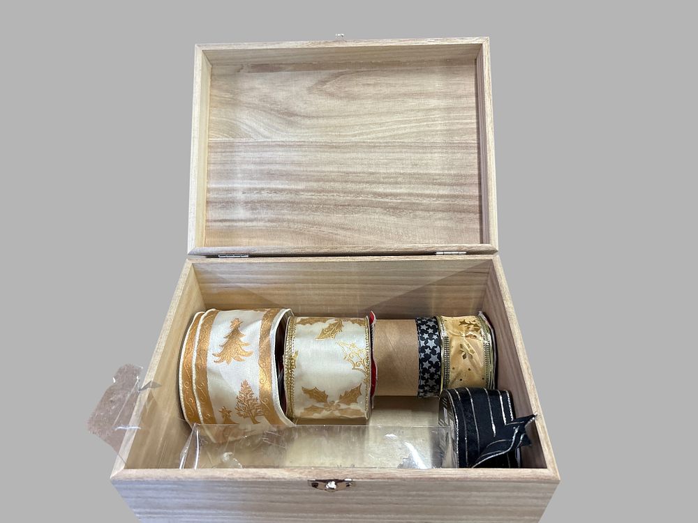 Lot 157: A Collection of Decorative Ribbons in a Wooden Storage Box