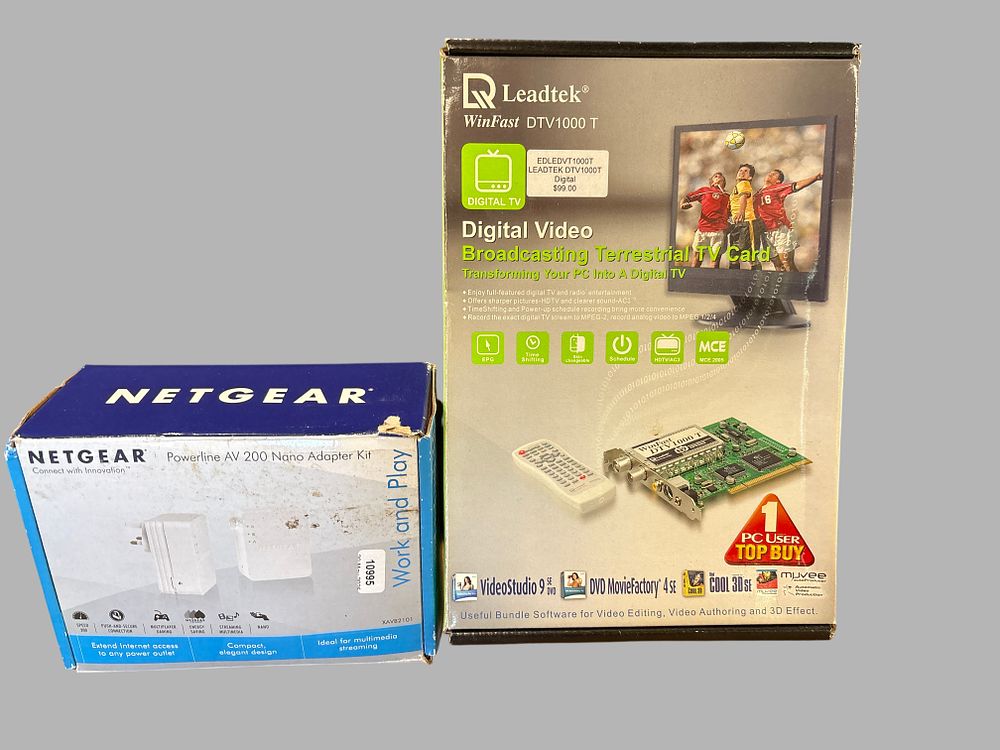 Lot 166: Two Boxed Computer Peripherals comprising a Leadtek WinFast DTV1000 T Digital TV Card and a Netgear Powerline AV 200 Nano Adapter Kit