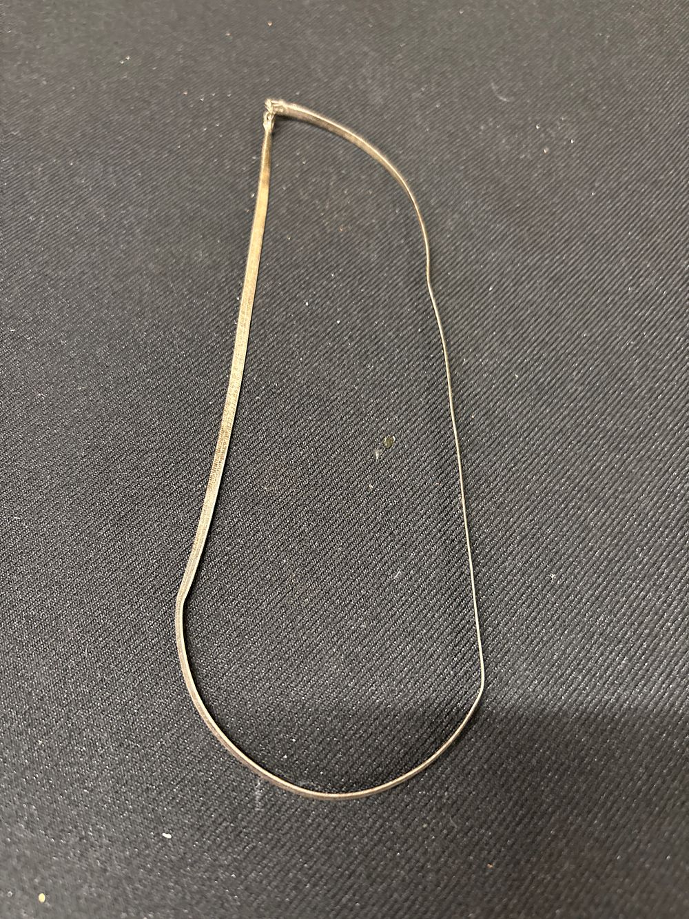 Lot 357: A Sterling Silver Flat Herringbone Snake Chain Necklace