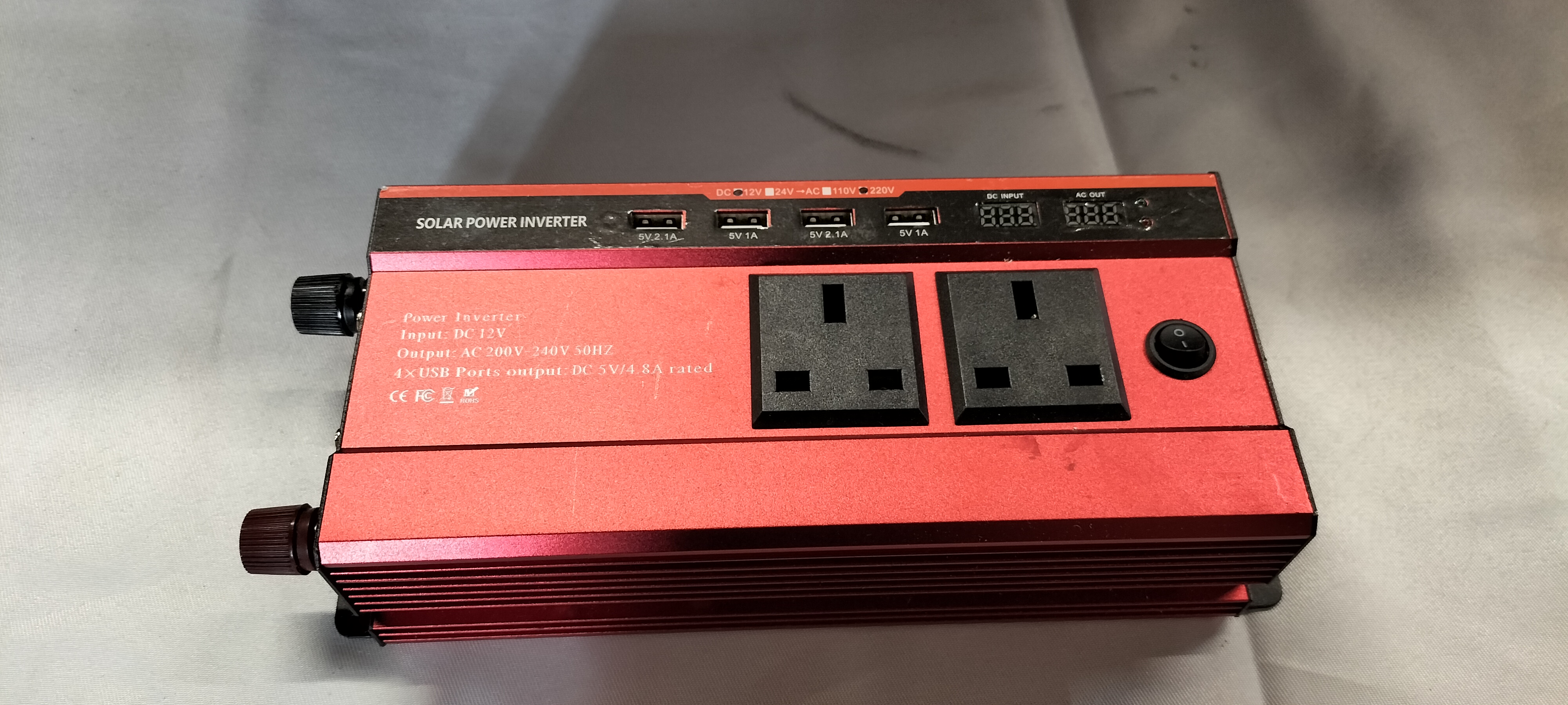A Portable Red Anodised Metallic Solar Power Inverter