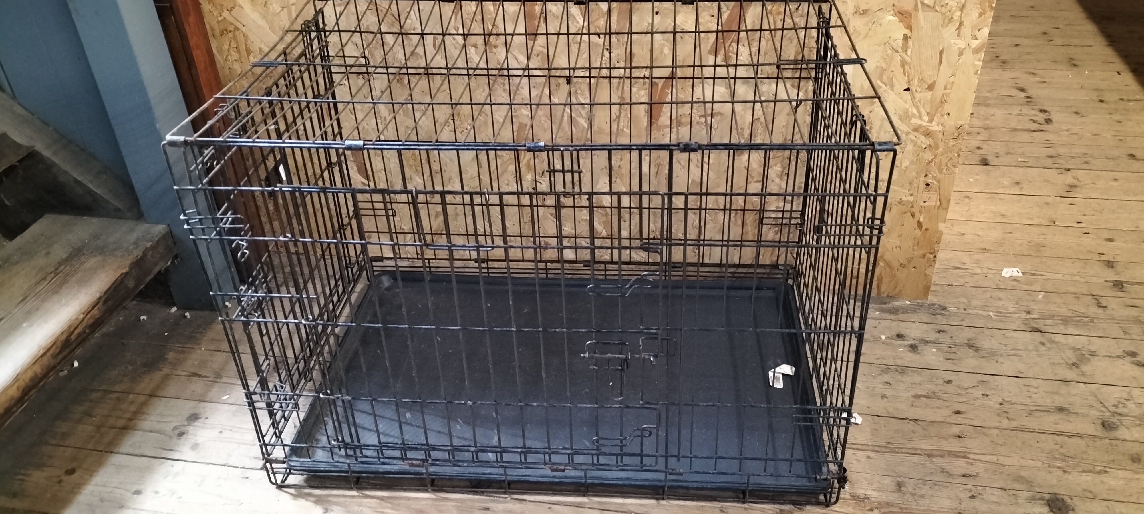 A KONG Black Coated Metal Wire Collapsible Two-Door Pet Crate