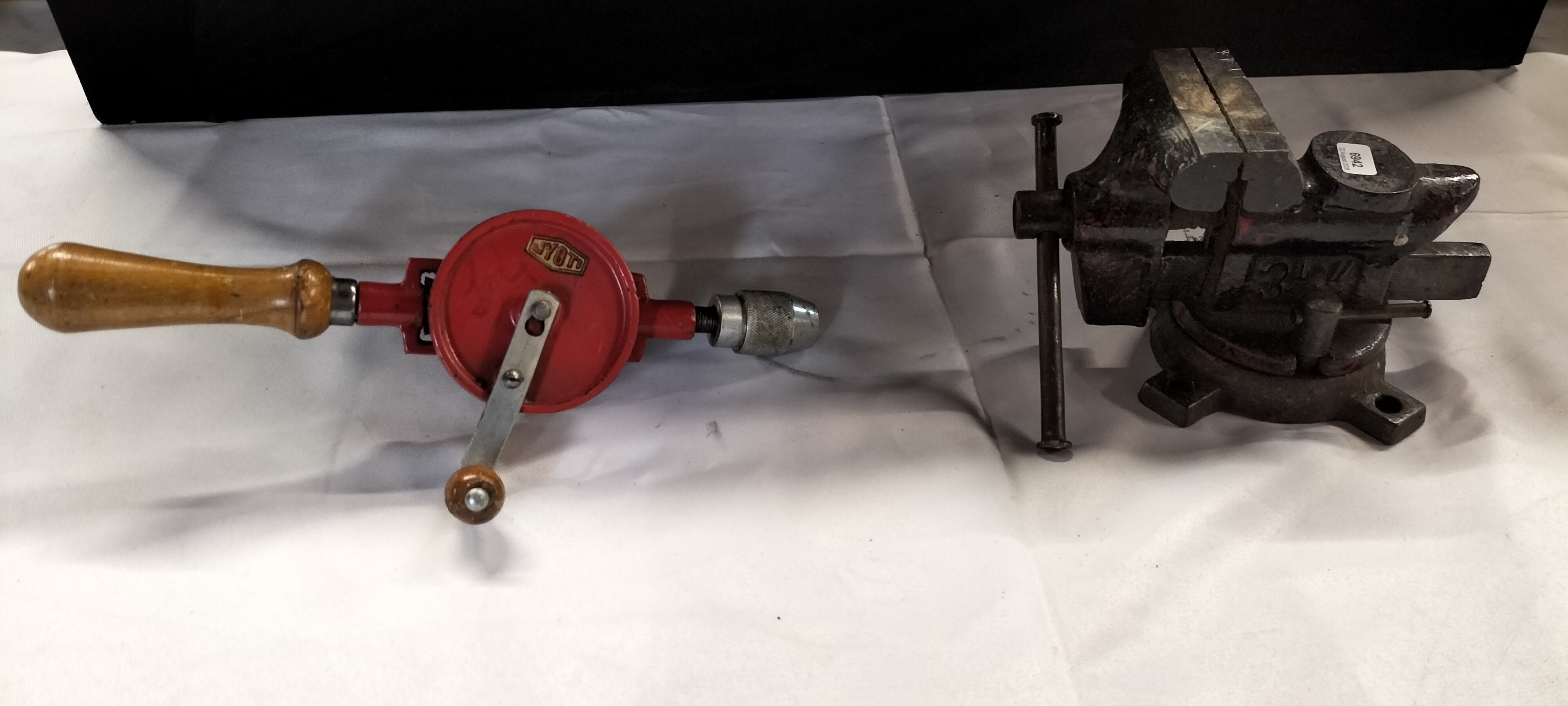 2 Workshop Tools comprising a Jyoti Manual Hand Drill and a Swivel Base Bench Vice