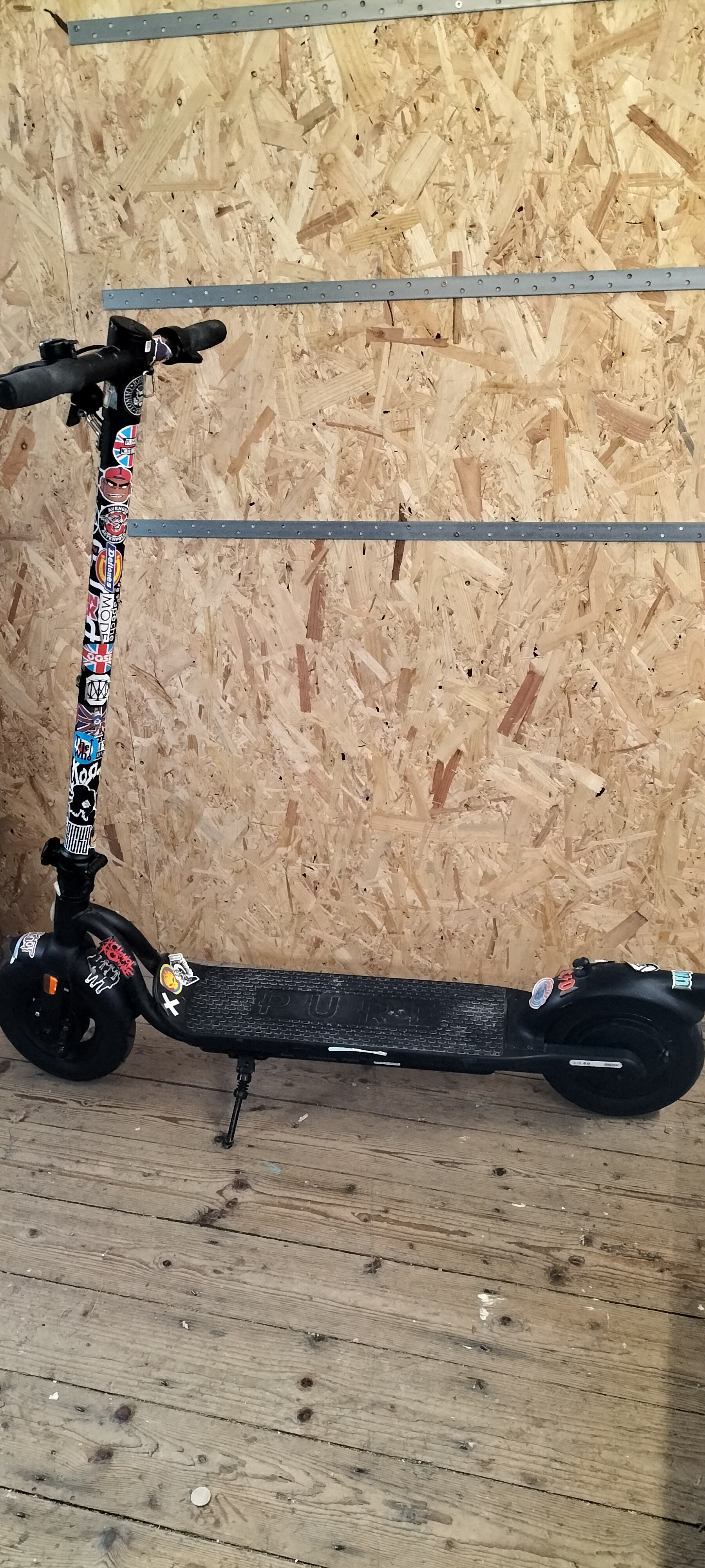 A Pure Electric Matte Black Folding Electric Scooter,