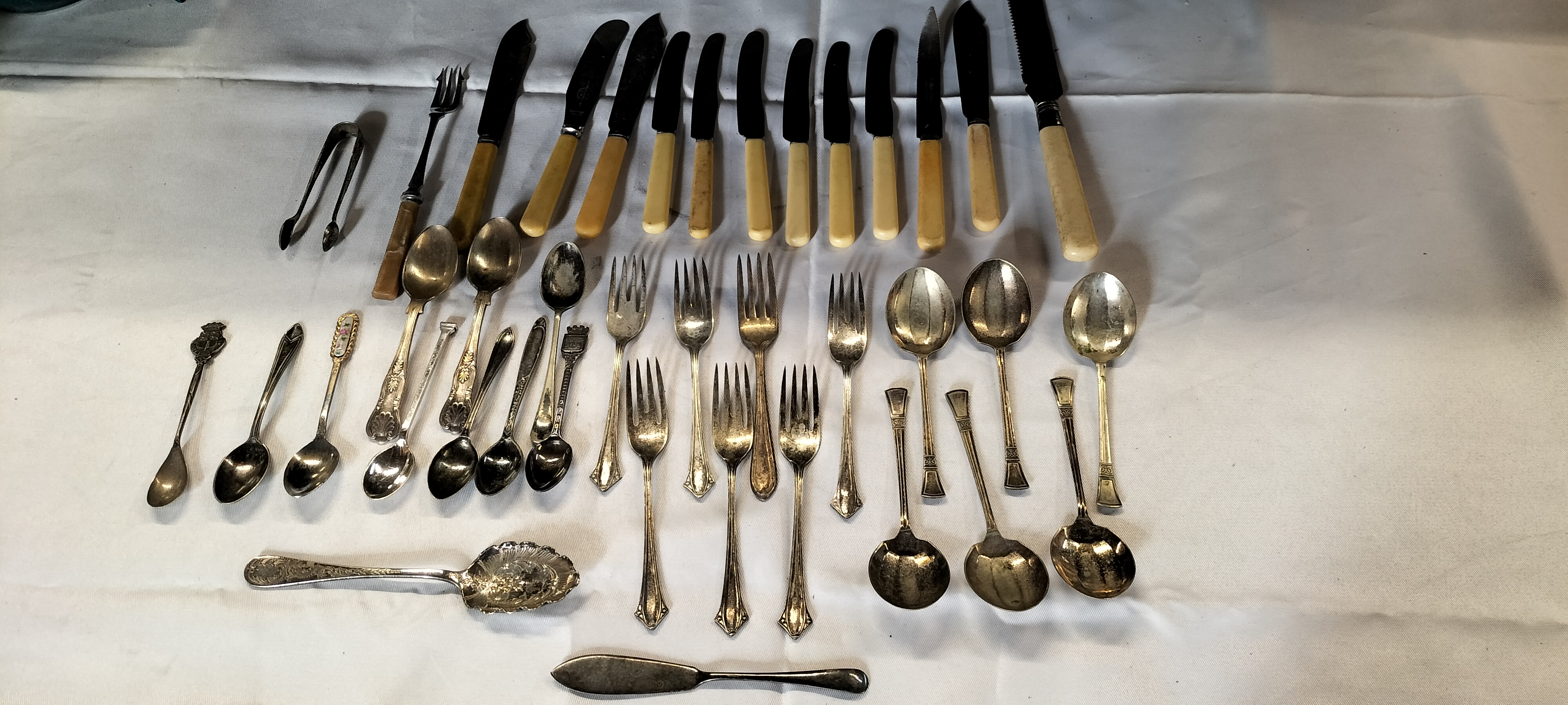 A Collection of 45 Silver Plated and Composite Handle Flatware and Serving Items