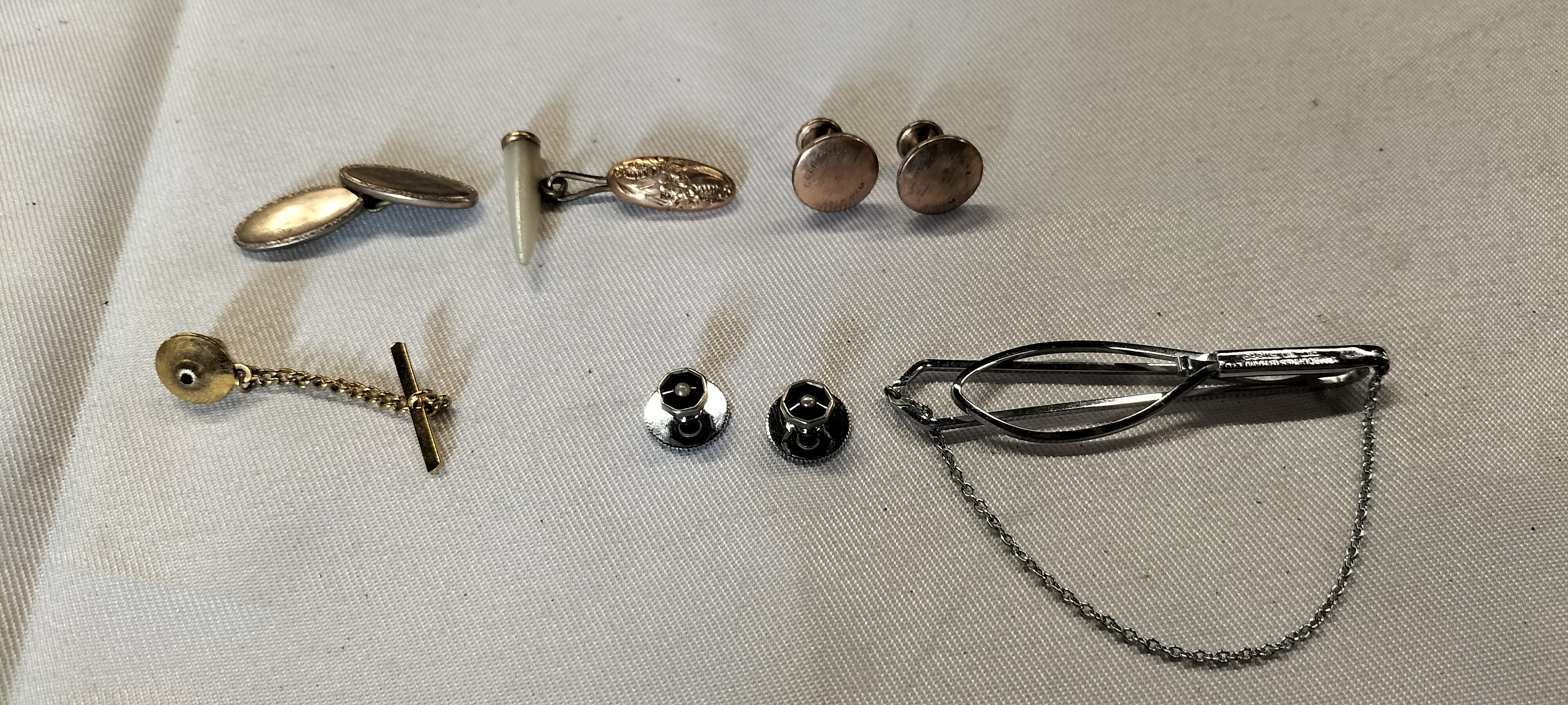 An Assortment of Silver Tone and Gold Plated Men's Dress Accessories