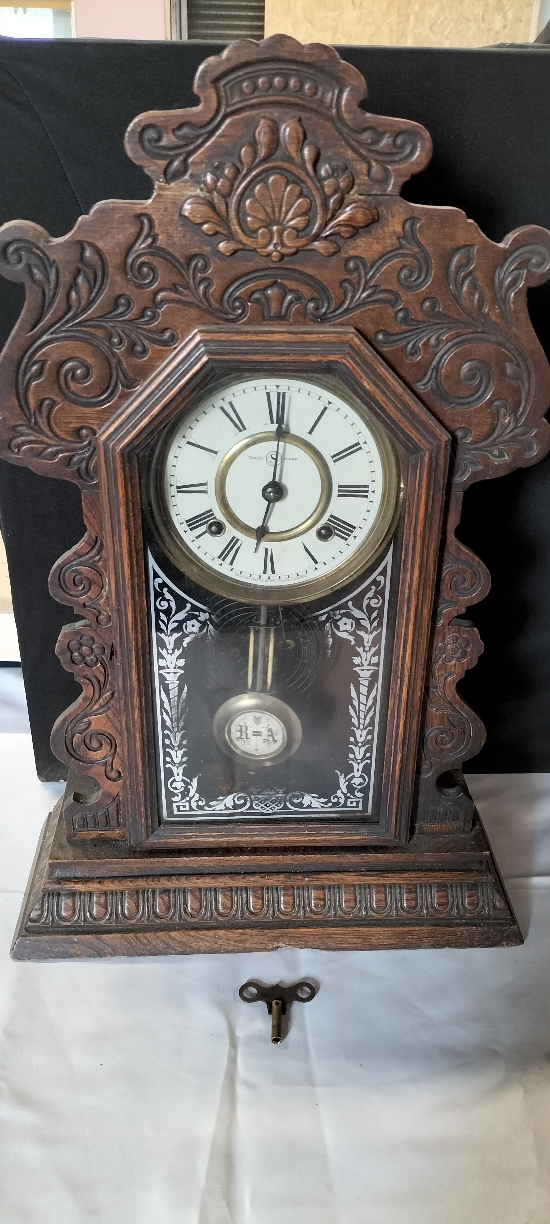 A Seikosha 8-Day Dark Wood Gingerbread Mantel Clock