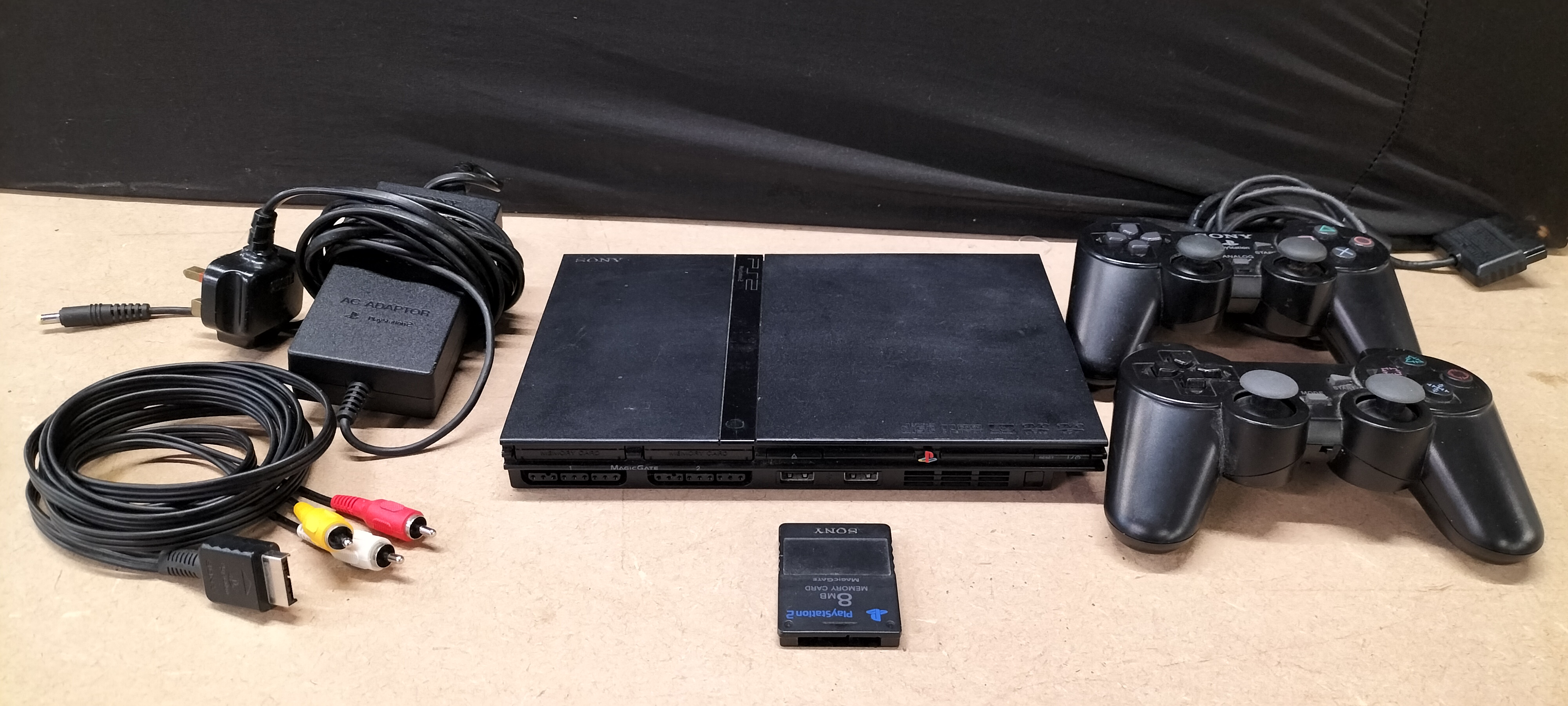 A Sony PlayStation 2 Slim Console Bundle including 2 Controllers, Model SCPH-79003
