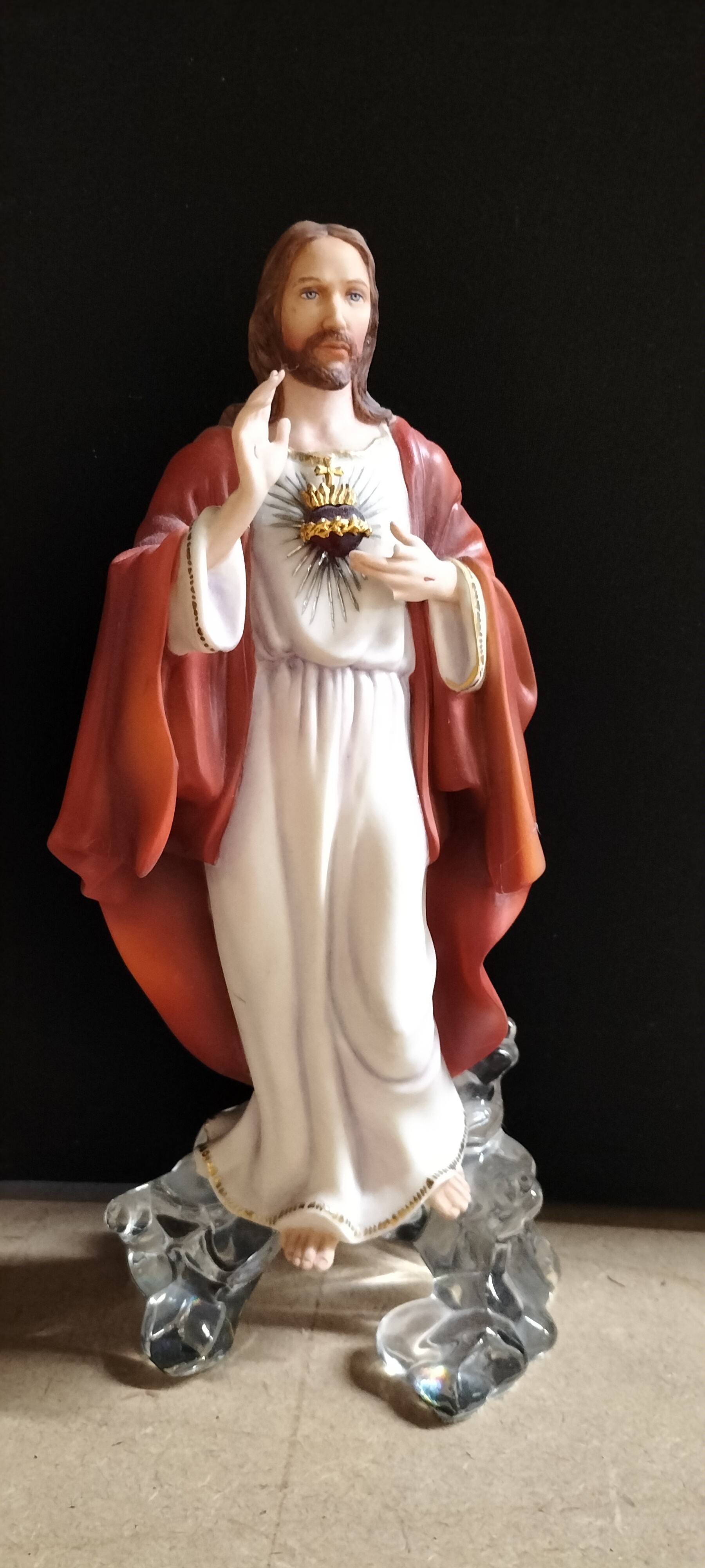 A Painted Composite Sacred Heart of Jesus Figurine on a Clear Resin Base