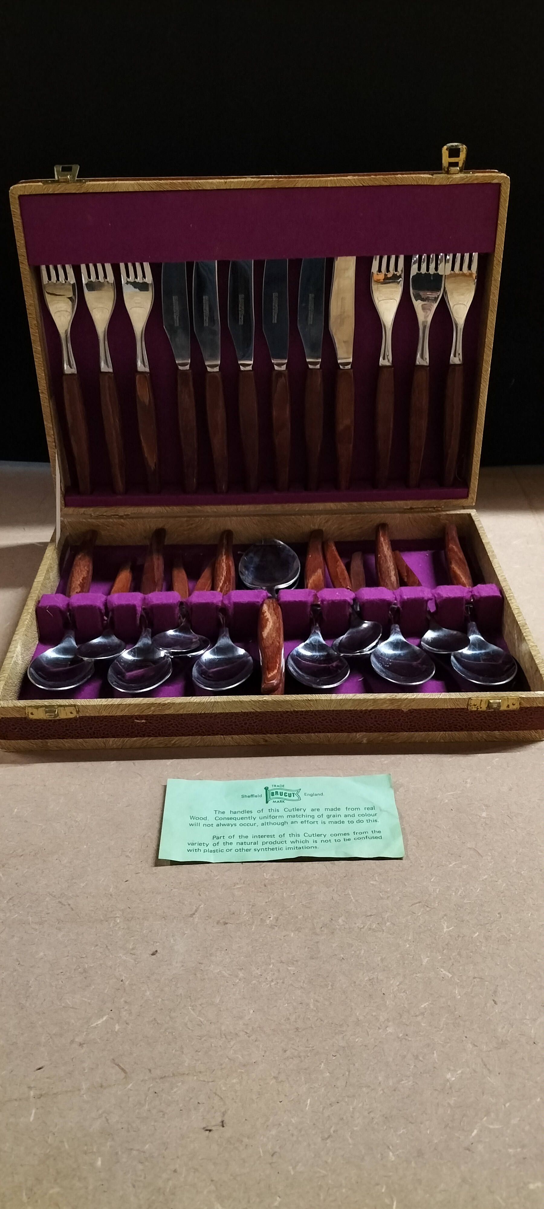 A 24 Piece Glosswood Stainless Steel and Wood Flatware Service